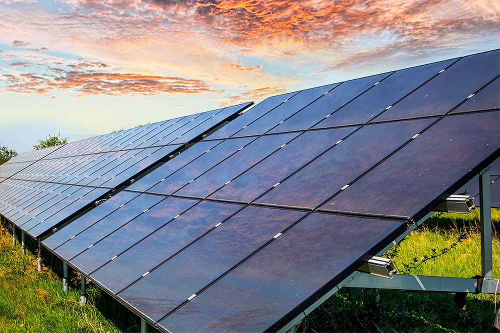 Solar Panels in field with beautiful sky in background