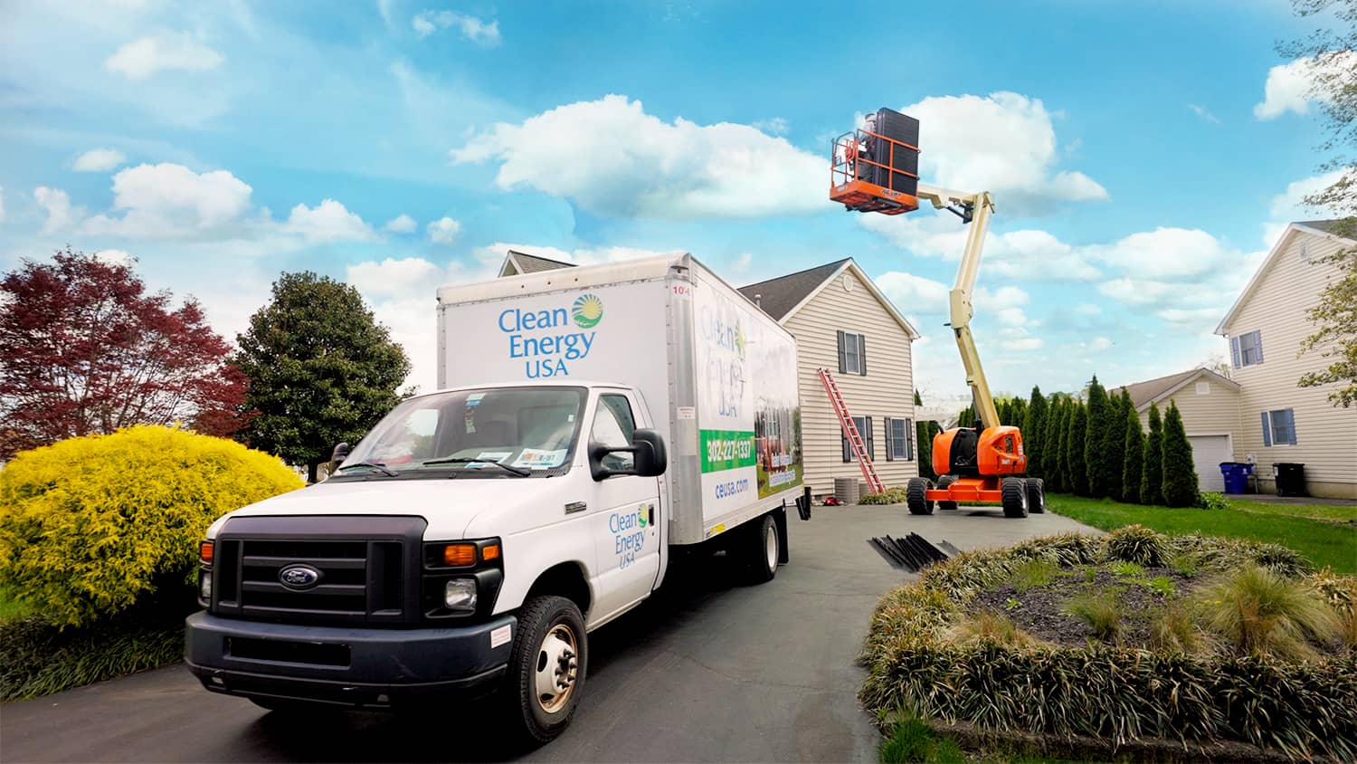 Clean Energy USA Truck with crane in background installing solar panel on residential roof